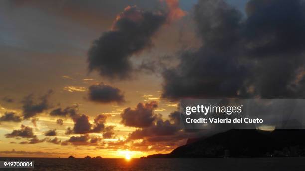 between islands and coast, the sunset from ipanema - valeria del cueto stock pictures, royalty-free photos & images