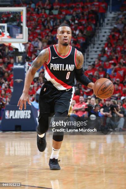 Damian Lillard of the Portland Trail Blazers handles the ball against the New Orleans Pelicans in Game Four of Round One of the 2018 NBA Playoffs on...