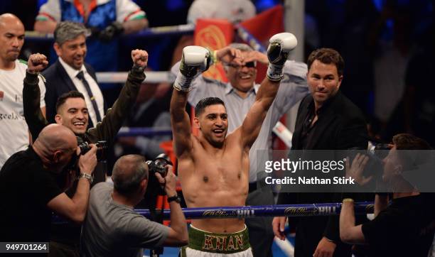 Amir Khan celebrates as he beats Phil Lo Greco during their welterweight title fight at Echo Arena on April 21, 2018 in Liverpool, England.
