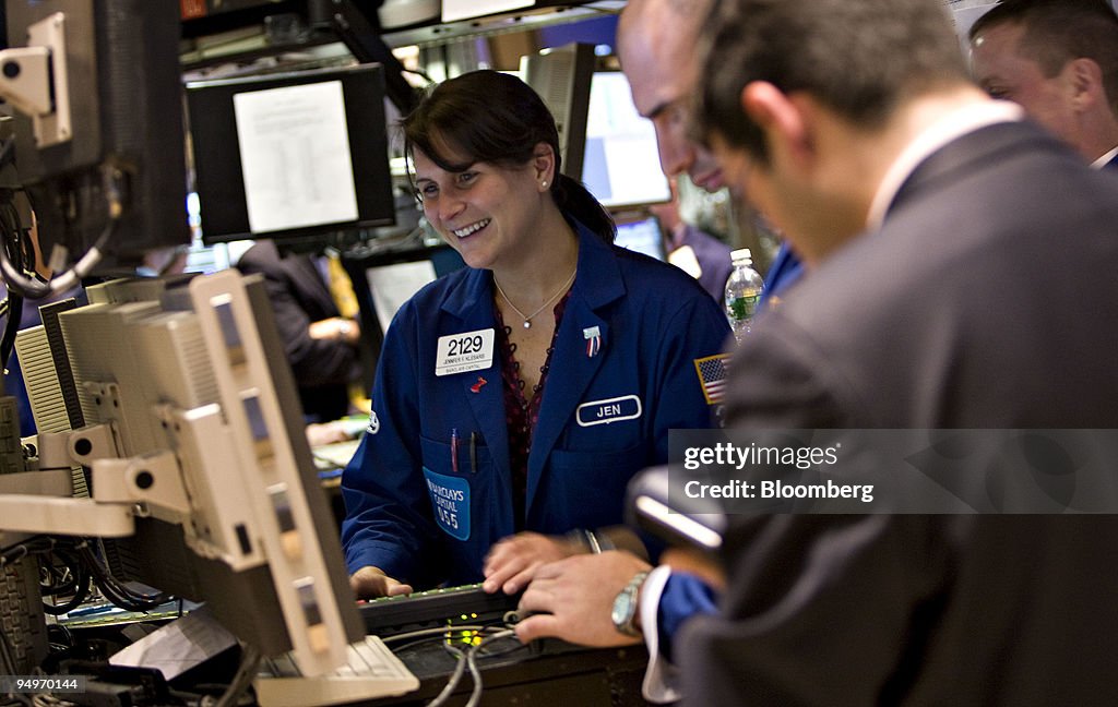 Jennifer Klesaris smiles as she works on the floor of the Ne