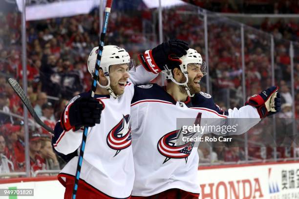 Oliver Bjorkstrand of the Columbus Blue Jackets celebrates with Josh Anderson after scoring a third period goal against the Washington Capitals...