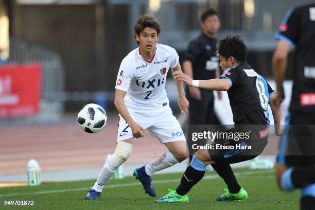 Atsuto Uchida of Kashima Antlers and Hiroyuki Abe of Kawasaki Frontale compete for the ball during the J.League J1 match between Kawasaki Frontale...