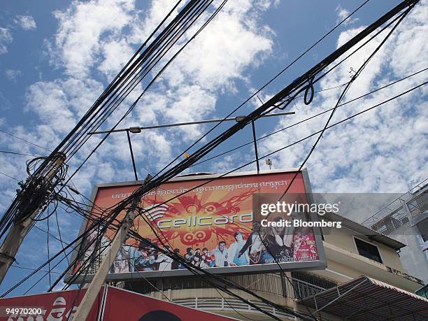 Cellcard mobile advertisement is displayed in downtown Phnom Penh, Cambodia, on Saturday, July 25, 2009. Cellcard, a pre-paid mobile phone network,...