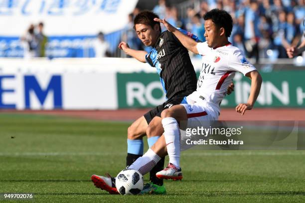 Atsutaka Nakamura of Kashima Antlers and Shintaro Kurumaya of Kawasaki Frontale compete for the ball during the J.League J1 match between Kawasaki...
