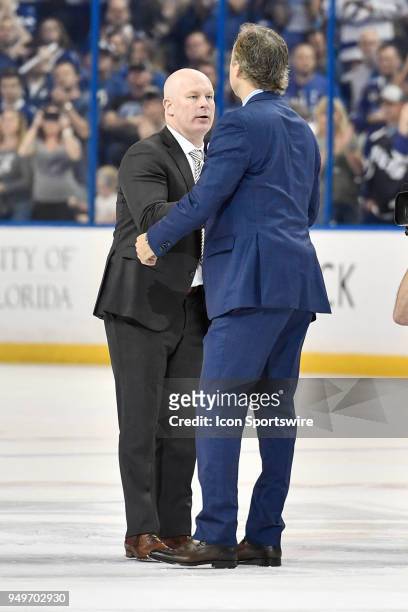 New Jersey Devils head coach John Hynes and Tampa Bay Lightning Head Coach John Cooper shakes hands after after the third period of an NHL Stanley...