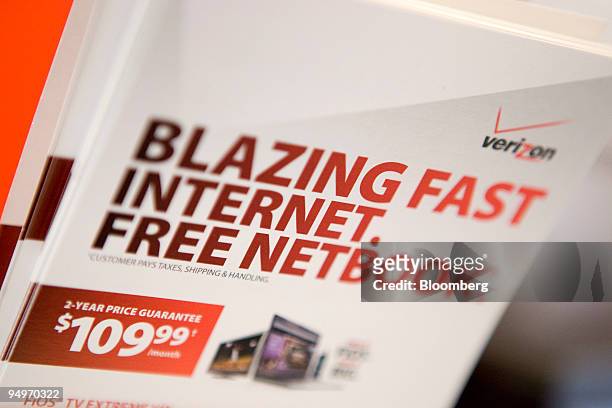Brochures for Verizon FiOS and a free netbook sit inside a Verizon Wireless store in New York, U.S., on Monday, July 27, 2009. Verizon Communications...
