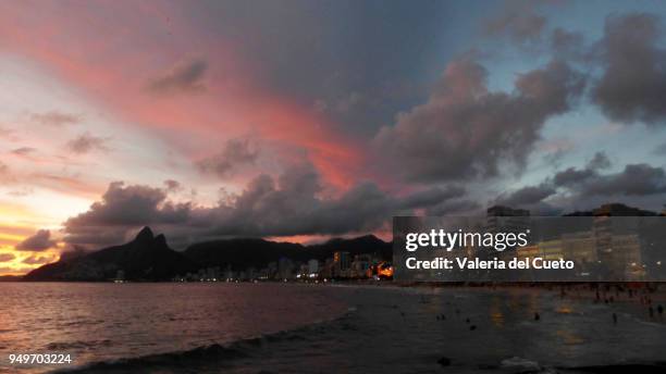 reflections of the sky in the clouds and buildings of ipanema - valeria del cueto stock pictures, royalty-free photos & images