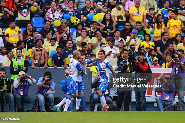 Alejandro Chumacero of Puebla celebrates with teammates after scoring the first goal of his team during the 16th round match between Puebla and...