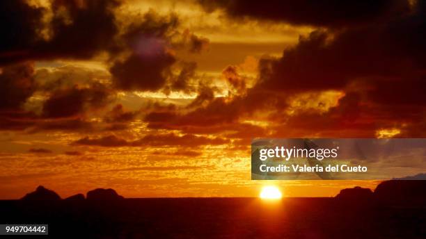 sun falling on the sea between tijucas islands  and joa point - valeria del cueto stock pictures, royalty-free photos & images