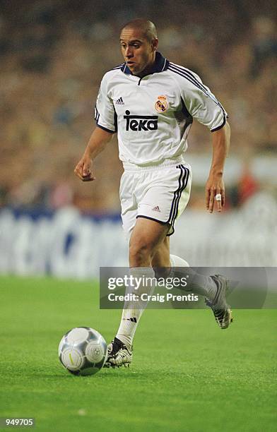 Roberto Carlos of Real Madrid runs with the ball during the UEFA Champions League Quarter Finals second leg match against Galatasaray played at the...