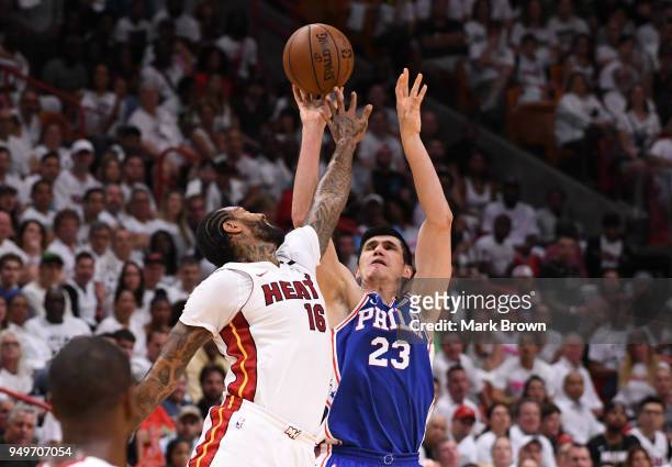 Ersan Ilyasova of the Philadelphia 76ers shoots the ball over James Johnson of the Miami Heat in the first quarter during Game Four of Round One of...