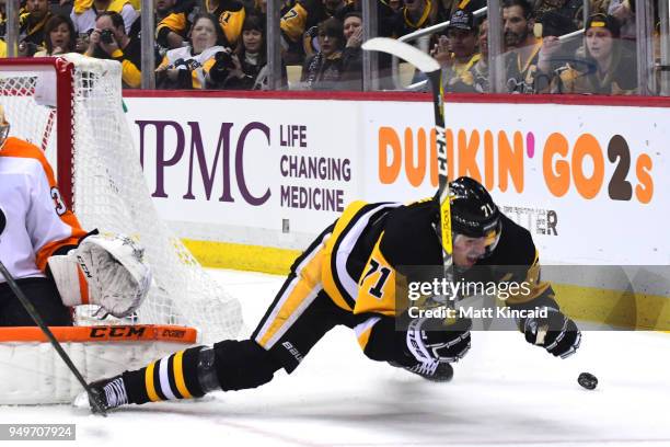 Evgeni Malkin of the Pittsburgh Penguins falls to the ice against the Philadelphia Flyers in Game Five of the Eastern Conference First Round during...