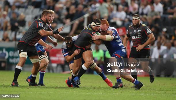 Steven Kitshoff of The DHL Stormers looks to tackle Juan Schoeman of the Cell C Sharks during the Super Rugby match between Cell C Sharks and DHL...