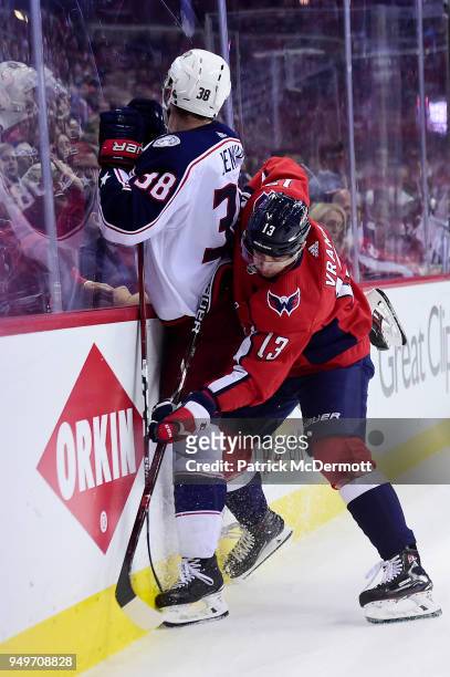 Boone Jenner of the Columbus Blue Jackets and Jakub Vrana of the Washington Capitals battle for the puck in the third period in Game Five of the...