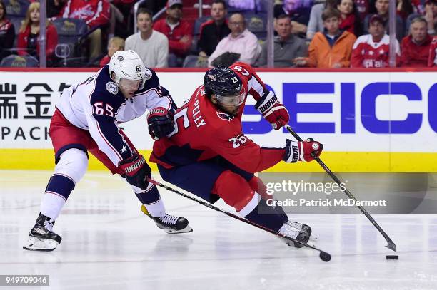 Devante Smith-Pelly of the Washington Capitals controls the puck against Markus Nutivaara of the Columbus Blue Jackets in the third period in Game...