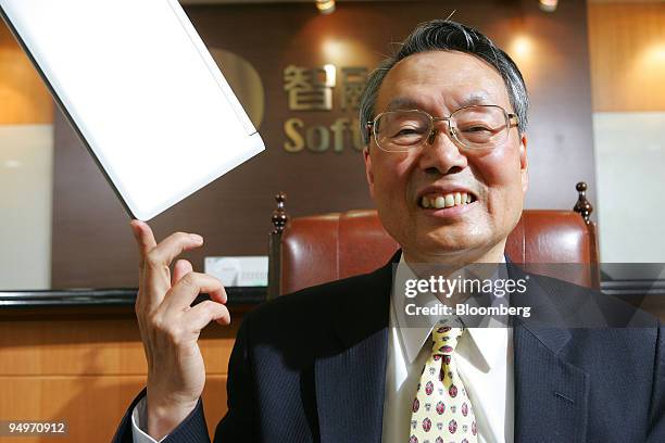 Stan Shih, founder of Acer Inc. And group chairman of iD SoftCapital Inc., poses for a photograph with an acer "Aspire One" laptop in Taipei, Taiwan,...