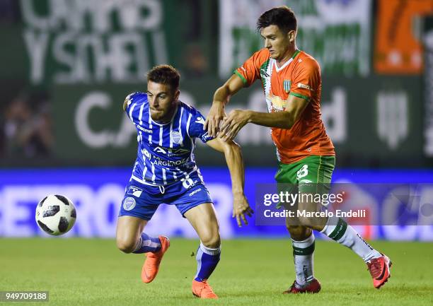 Angel Gonzalez of Godoy Cruz fights for the ball with Adrian Sporle of Banfield during a match between Banfield and Godoy Cruz as part of Argentina...