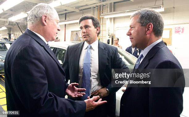 Pat Quinn, governor of Illinois, left to right, Mark Fields, president of the Americas for Ford Motor Co. And Joe Hinrichs, Ford Motor Co. Group vice...