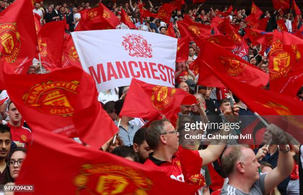 Manchester United fans with flags and banners during The Emirates FA Cup Semi Final between Manchester United and Tottenham Hotspur at Wembley...