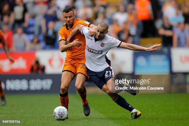 Romain Saiss of Wolverhampton Wanderers competes with Darren Pratley of Bolton Wanderers during the Sky Bet Championship match between Bolton...