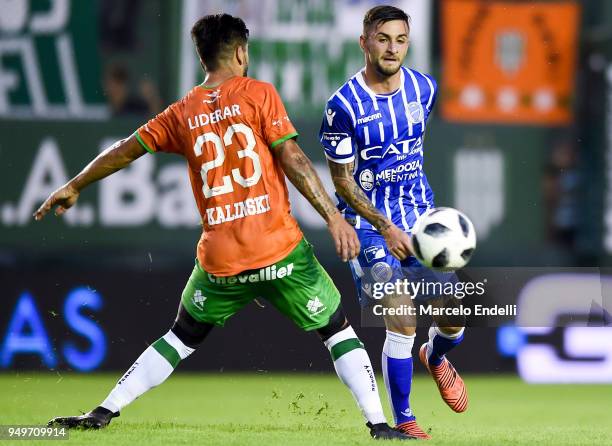 Angel Gonzalez of Godoy Cruz fights for the ball with Enzo Kalinski of Banfield during a match between Banfield and Godoy Cruz as part of Argentina...