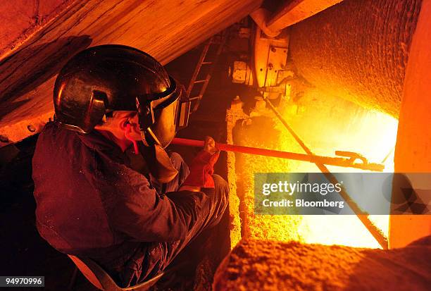 Jeff McPherson welds the roller to help separate sugar cane pulp at Bundaberg Sugar's Millaquin Mill in Bundaberg, Queensland, Australia, on Friday,...