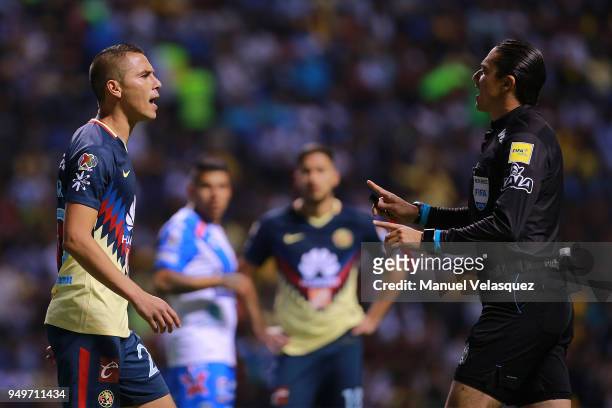 Paul Aguilar of America argues with referee Oscar Macias during the 16th round match between Puebla and America as part of the Torneo Clausura 2018...