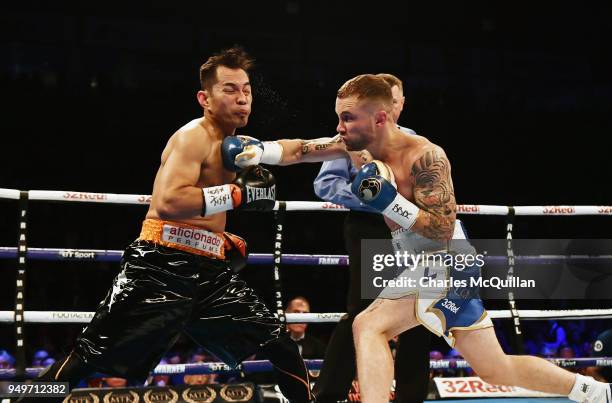 Carl Frampton and Nonito Donaire during their WBO Interim World Featherweight championship bout at SSE Arena Belfast on April 21, 2018 in Belfast,...