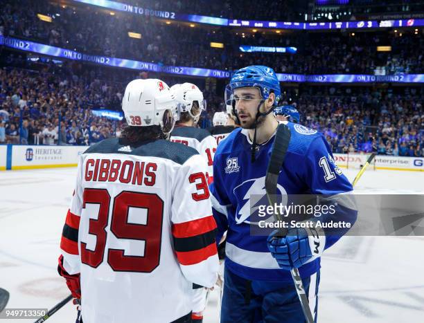 Cedric Paquette of the Tampa Bay Lightning and Brian Gibbons of the New Jersey Devils shake hands after Game Five of the Eastern Conference First...