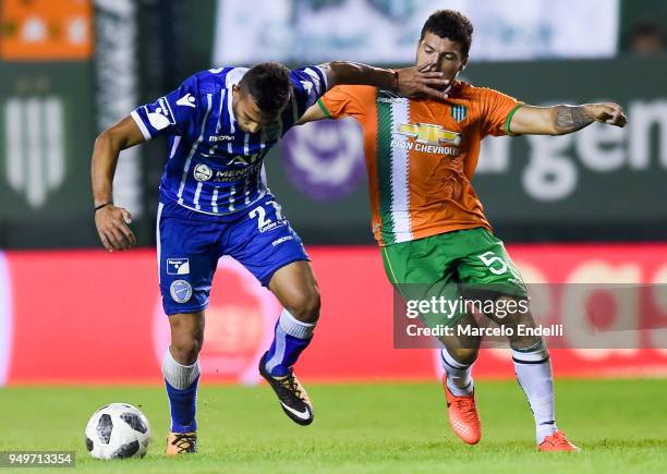 Victorio Ramis of Godoy Cruz fights for the ball with Eric Remedi of Banfield during a match between Banfield and Godoy Cruz as part of Argentina...