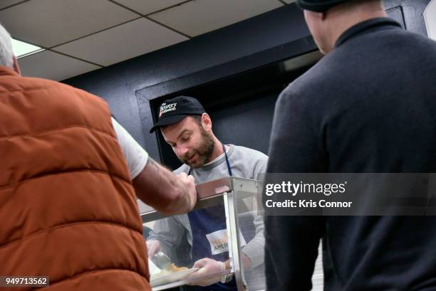 Actor Liev Schreiber volunteers with Feeding America at The Bowery Mission on April 21, 2018 in New York City.