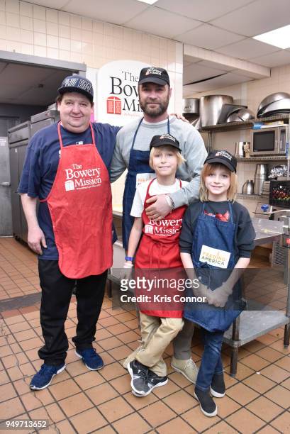 Actor Liev Schreiber with sons Alexander Pete Schreiber and Samuel Kai Schreiber volunteer with Chef John Gaspat and Feeding America at The Bowery...