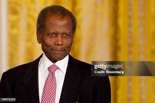 Actor Sidney Poitier arrives at the 2009 Presidential Medal of Freedom ceremony in the East Room of the White House in Washington, D.C., U.S., on...