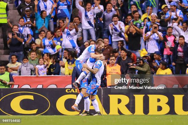 Omar Fernandez of Puebla celebrates with teammates after scoring the second goal of his team during the 16th round match between Puebla and America...