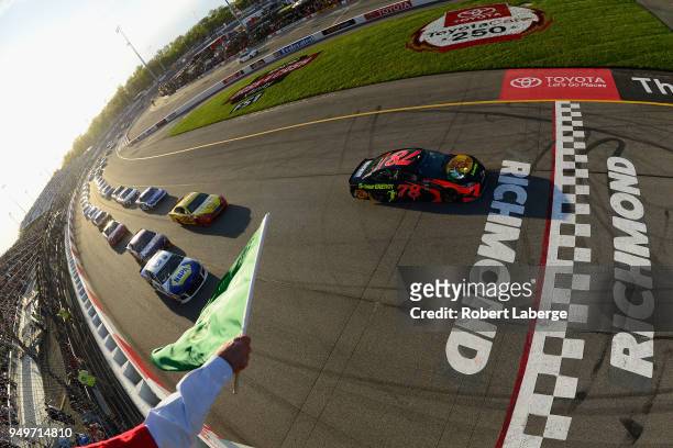 Martin Truex Jr., driver of the Bass Pro Shops/5-hour ENERGY Toyota, takes the green flag to start the Monster Energy NASCAR Cup Series Toyota Owners...