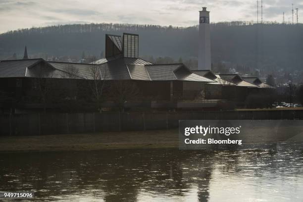 The Chemung River runs past the Corning Inc. Headquarters in Corning, New York, U.S., on Monday, March 27, 2017. Corning, a manufacture of liquid...
