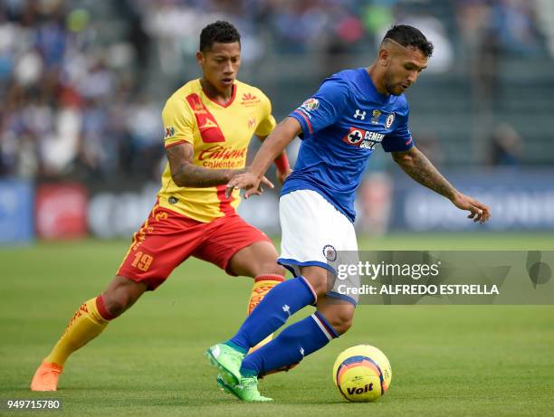 Cruz Azul's player Walter Montoya vies for the ball with Morelia's Carlos Sosa during their 2018 Mexican Clausura tournament football match at the...