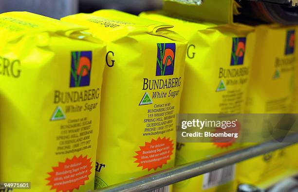 Bags of white sugar roll along the packaging line at the Bundaberg Sugar refinery in Bundaberg, Queensland, Australia, on Friday, Aug. 14, 2009. The...