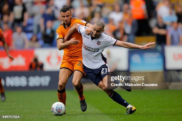 Romain Saiss of Wolverhampton Wanderers competes with Darren Pratley of Bolton Wanderers during the Sky Bet Championship match between Bolton...