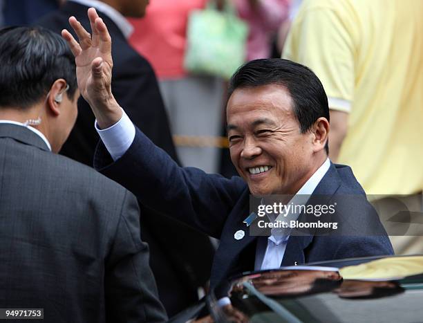 Taro Aso, Japan's prime minister and president of the Liberal Democratic Party , waves as he arrives for a campaign rally for the general election in...