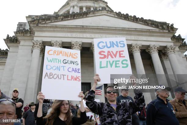 Gun advocates are pictured in front of the state capitol during the "March for Our Rights" pro-gun rally in Olympia, Washington on April 21, 2018.