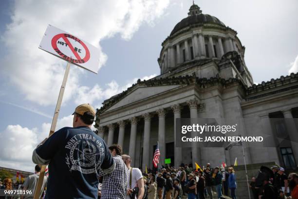 Gun advocates are pictured in front of the Washington state capitol during the "March for Our Rights" pro-gun rally in Olympia, Washington on April...