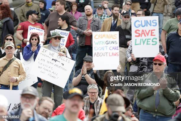 Gun advocates are pictured in front of the Washington state capitol during the "March for Our Rights" pro-gun rally in Olympia, Washington on April...