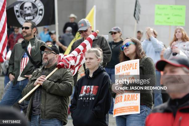 Gun advocates are pictured in front of the Washington state capitol during the "March for Our Rights" pro-gun rally in Olympia, Washington on April...