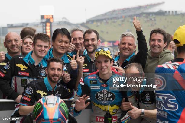 Alex Marquez of Spain and EG 0,0 Marc VDS celebrates with team the Moto2 pole position at the end of the qualifying practice during the MotoGp Red...
