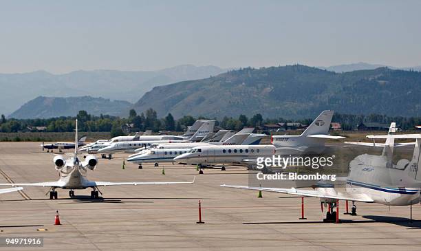Private jets sit parked at the Jackson Hole airport in Jackson, Wyoming, U.S., on Thursday, Aug. 20, 2009. Thomas Hoenig, president of the Kansas...