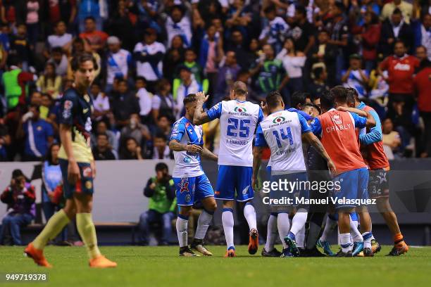 Pablo Gonzalez of Puebla celebrates with teammates after scoring the third goal of his team during the 16th round match between Puebla and America as...