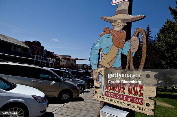 Sign advertises nightly shoot outs in downtown Jackson, Wyoming, U.S., on Thursday, Aug. 20, 2009. Thomas Hoenig, president of the Kansas City...