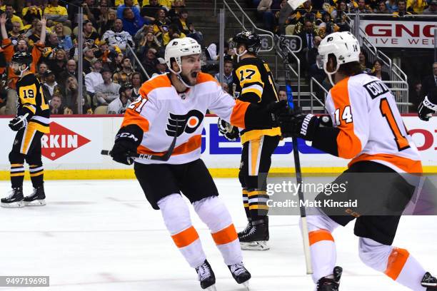 Scott Laughton of the Philadelphia Flyers celebrates Sean Couturier's game winning goal against the Pittsburgh Penguins in Game Five of the Eastern...