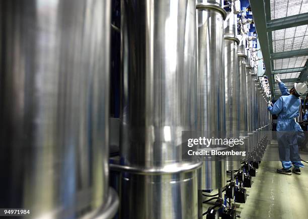Member of the media examines equipment for emergency control rods inside the building which houses the No. 5 reactor at Chubu Electric Power Co.'s...